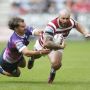 Picture by Ed Sykes/SWpix.com - 24/06/2022 - Rugby League - Betfred Super League Round 16 - Wigan Warriors v Toulouse Olympique - DW Stadium, Wigan, England - Wigan Warriors' Jake Bibby and Toulouse Olympique's Mathieu Jussaume in action
